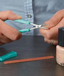 man clipping fingernails with scissors