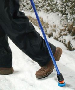 Man Walking in snow using a Flexyfeet ice boot attachment