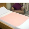 Washable continence pad on bed