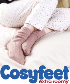 A pair of feet snuggled up on the bed in Cosyfeet Bed socks