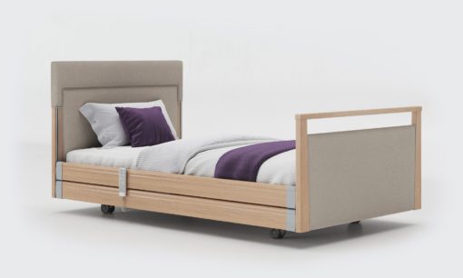 Upholstered profiling care bed with rails in Oak