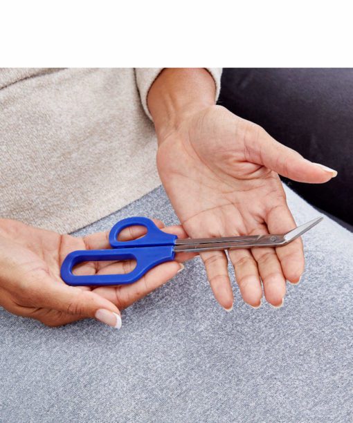 Lady holding apair of long handled toe nail scissors